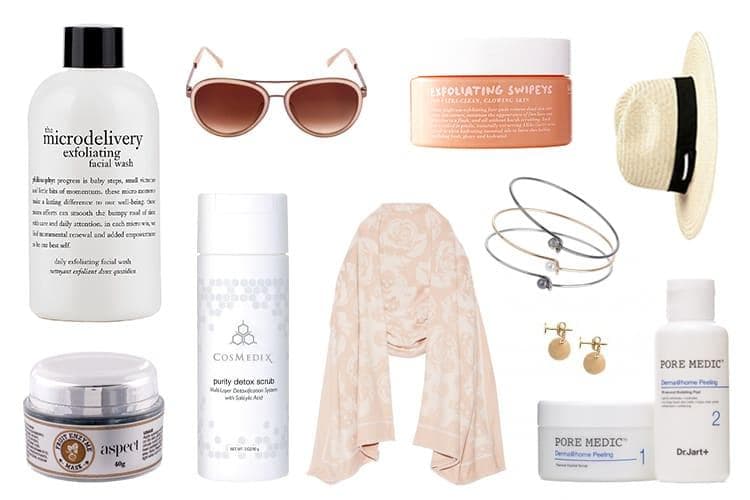 Flat lay of five facial exfoliant products including powders, peeling gels and treatment kits on a white surface