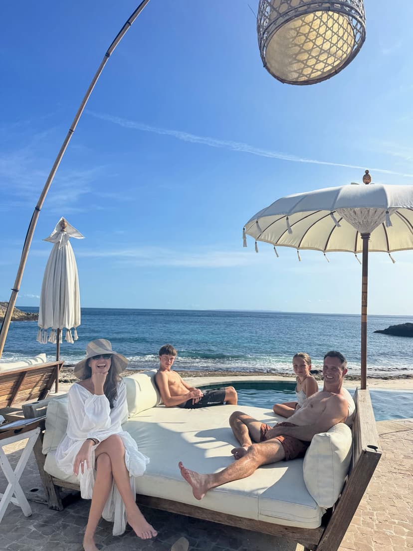 Our group on the oceanfront daybed at Sandy Bay Beach Club, Nusa Lembongan