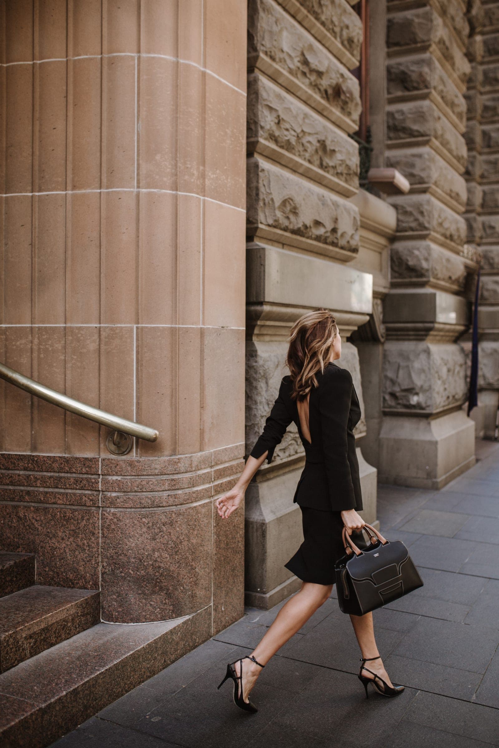 Sigourney Cantelo striding through the city