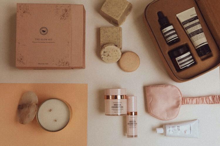 Luxury beauty gift sets and skincare products arranged with gold packaging and festive styling