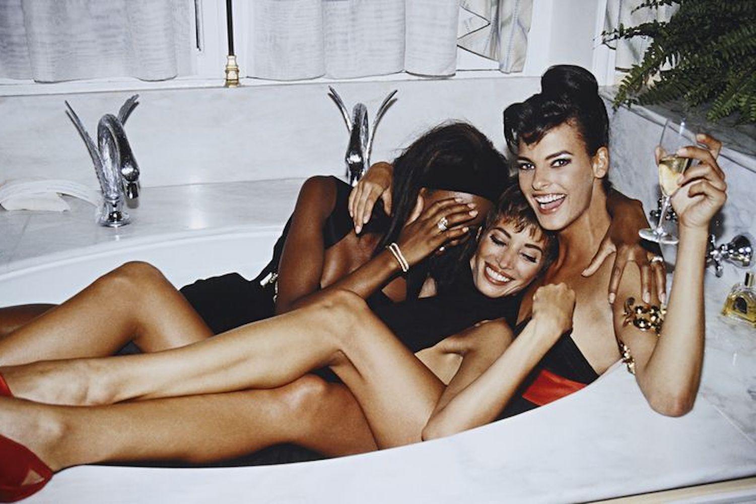 Luxury beauty products for NYE including liquid eye shadow, designer lipstick and shimmering body oil on elegant backdrop