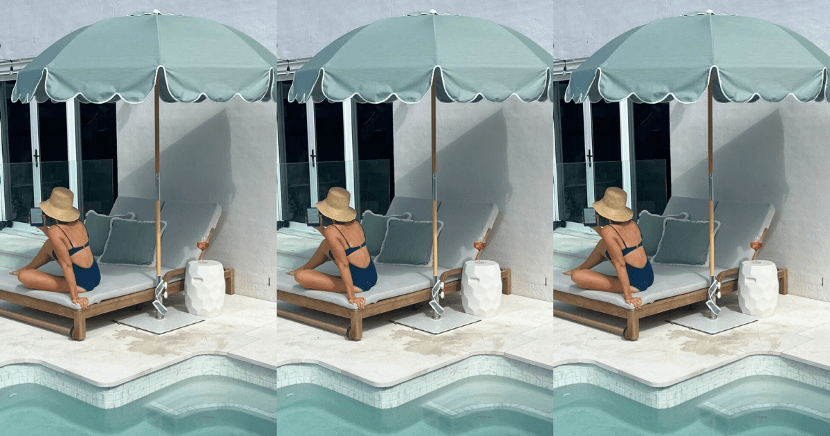 Array of premium sunscreen bottles and wide-brimmed sun hats arranged on a neutral background