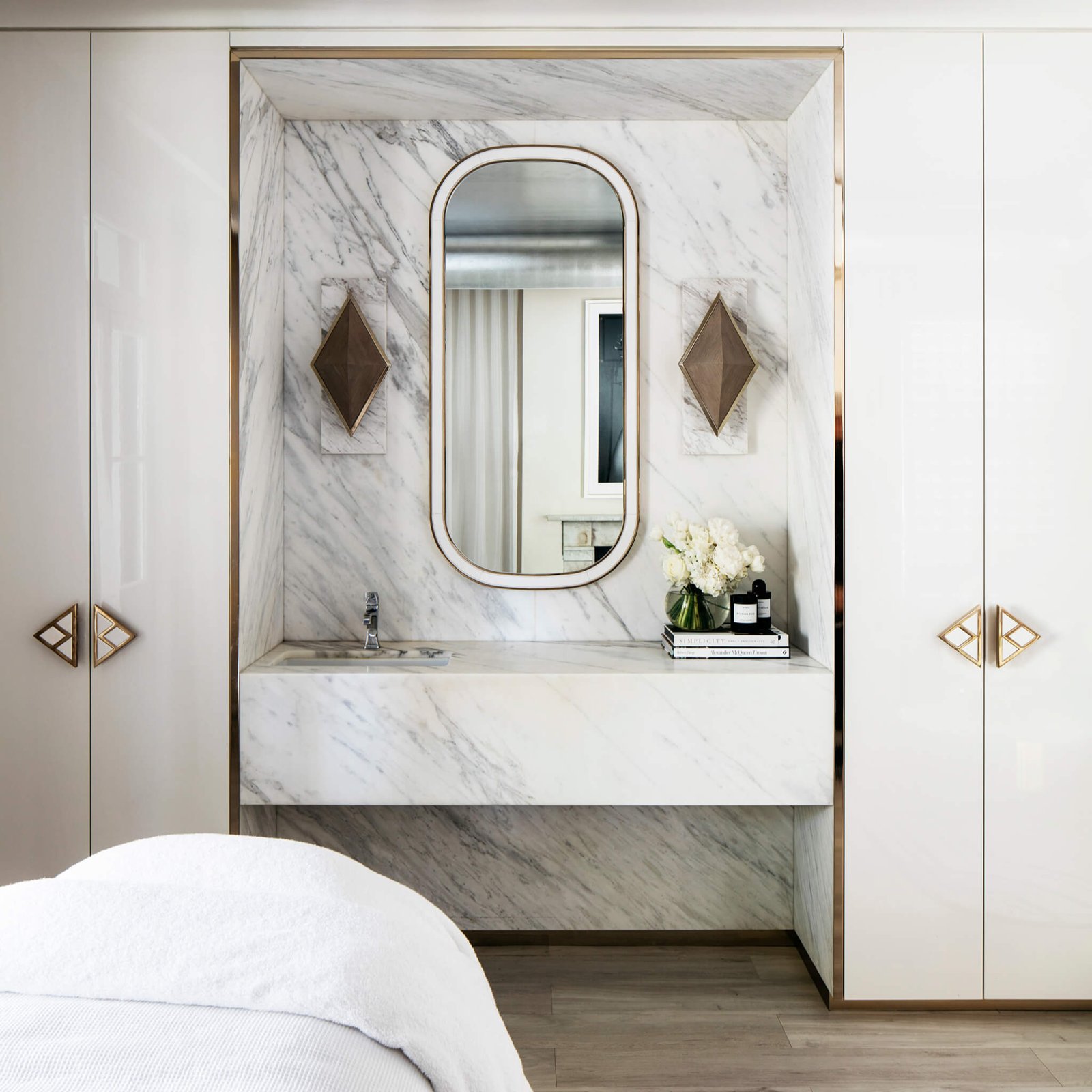 Marble vanity and treatment bed in a Blainey North-designed treatment room at All Saints Skin Clinic, Double Bay