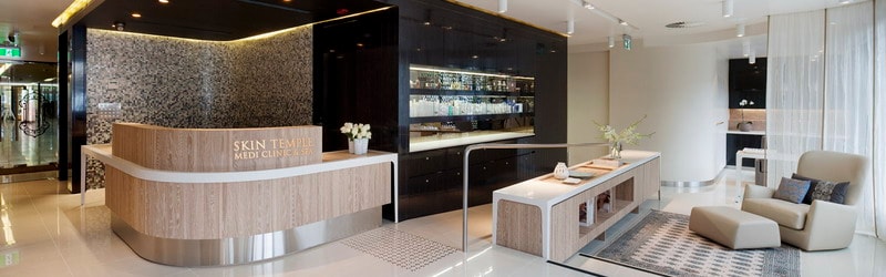 Luxurious medispa treatment room with heated bed, soft lighting and tiled hammam features at Skin Temple Melbourne