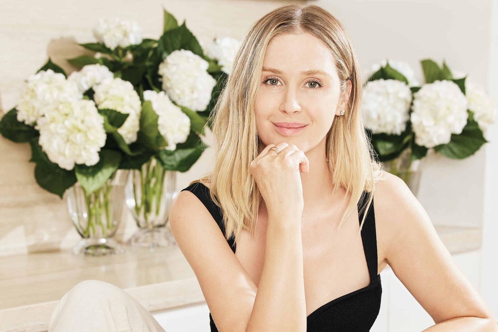 Melanie Grant, professional facialist, demonstrating skincare techniques in her treatment room