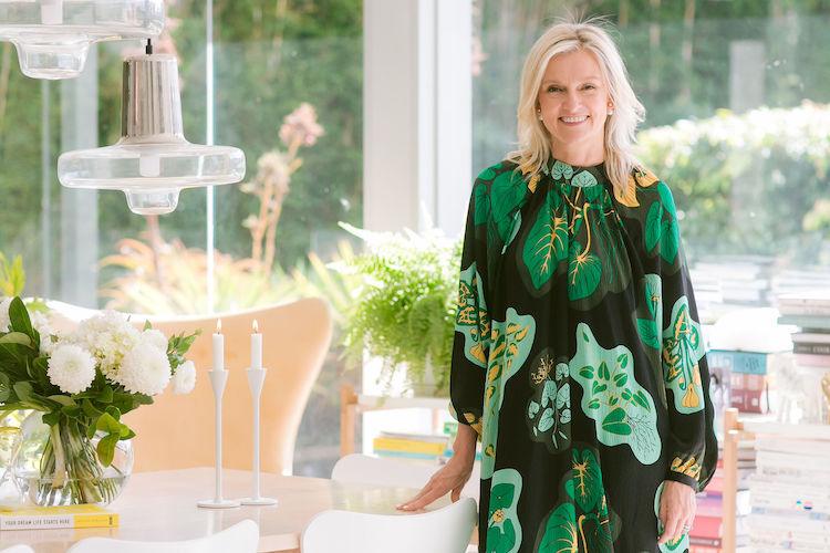 Kristina Karlsson, founder of kikki.K, in a minimalist workspace with stationery and design elements