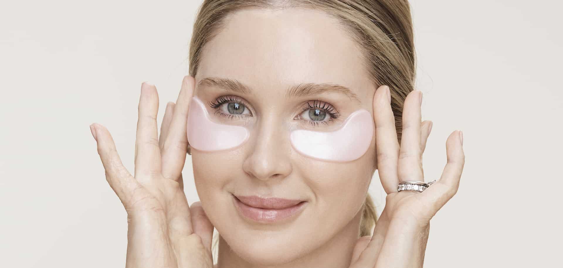 Celebrity facialist Melanie Grant pressing under-eye recovery patches beneath her eyes