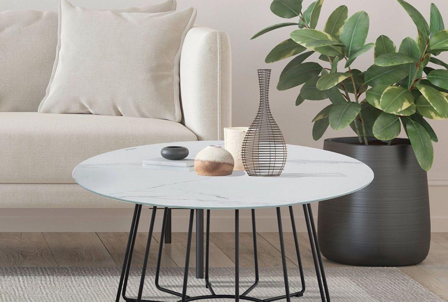 Scandinavian-inspired home office with beige marble table, scalloped velvet chair, and minimalist décor styling