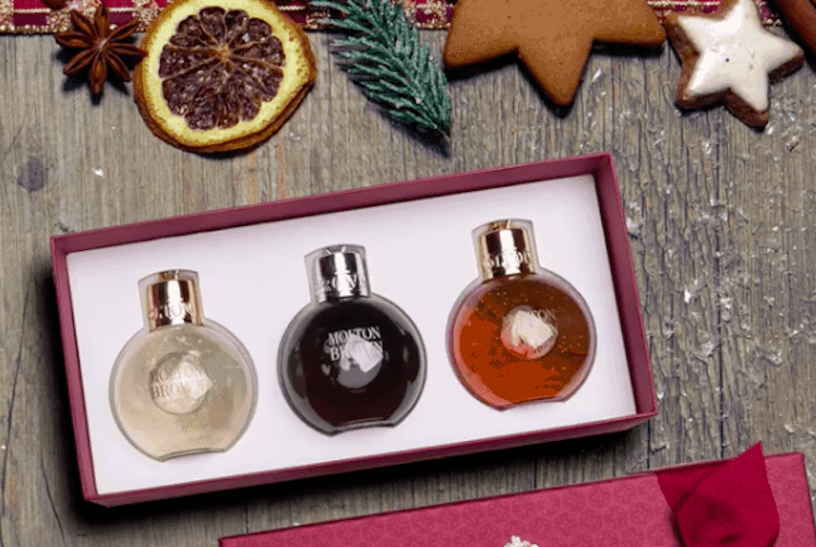 Molton Brown Pink Pepperpod festive bauble hanging on a decorated Christmas tree