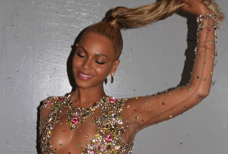 Beyoncé at the Met Gala wearing glamorous makeup and styled hair with Oriental-inspired beauty elements