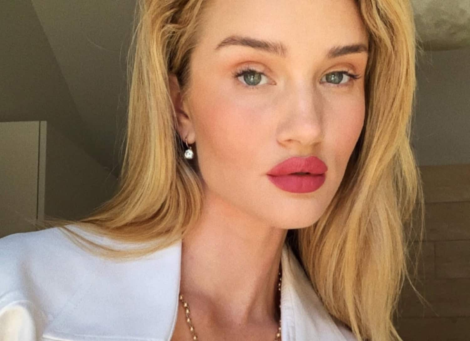 Woman's lips immediately after lipstick tattoo procedure showing swelling and intense peachy-pink pigmentation