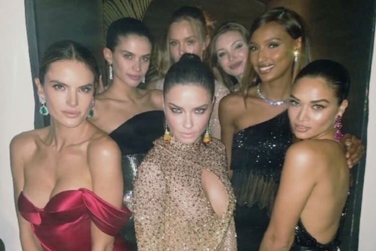 Supermodel with expertly applied blue eyeshadow and defined eye makeup for party season