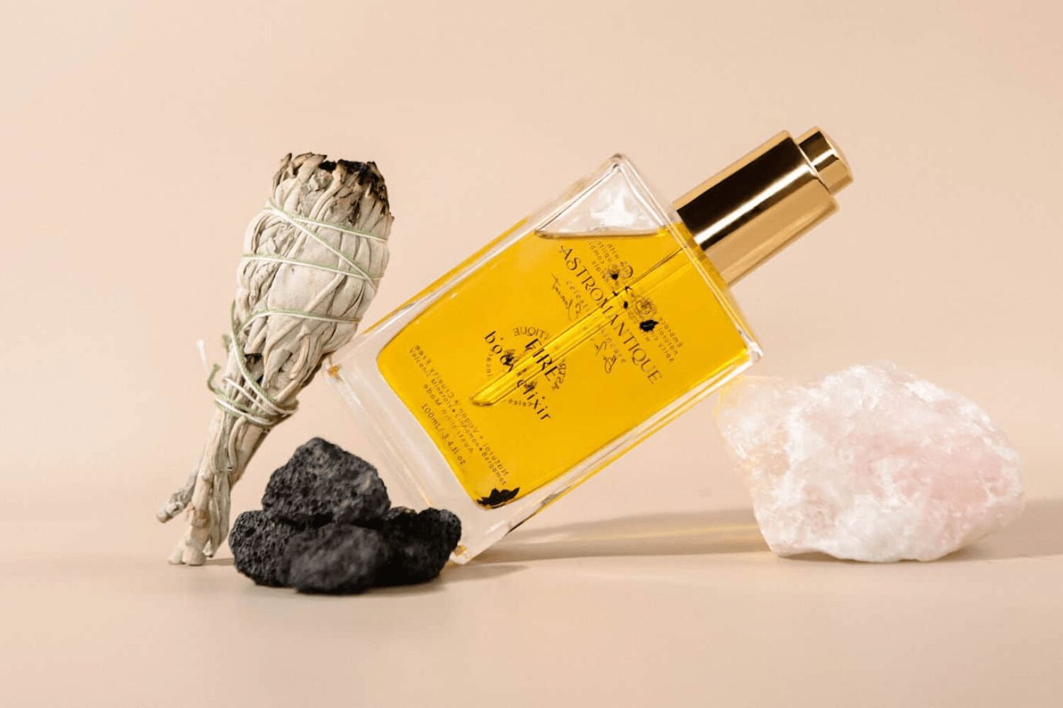 Two sisters holding zodiac-inspired body elixir bottles with celestial branding and natural ingredients
