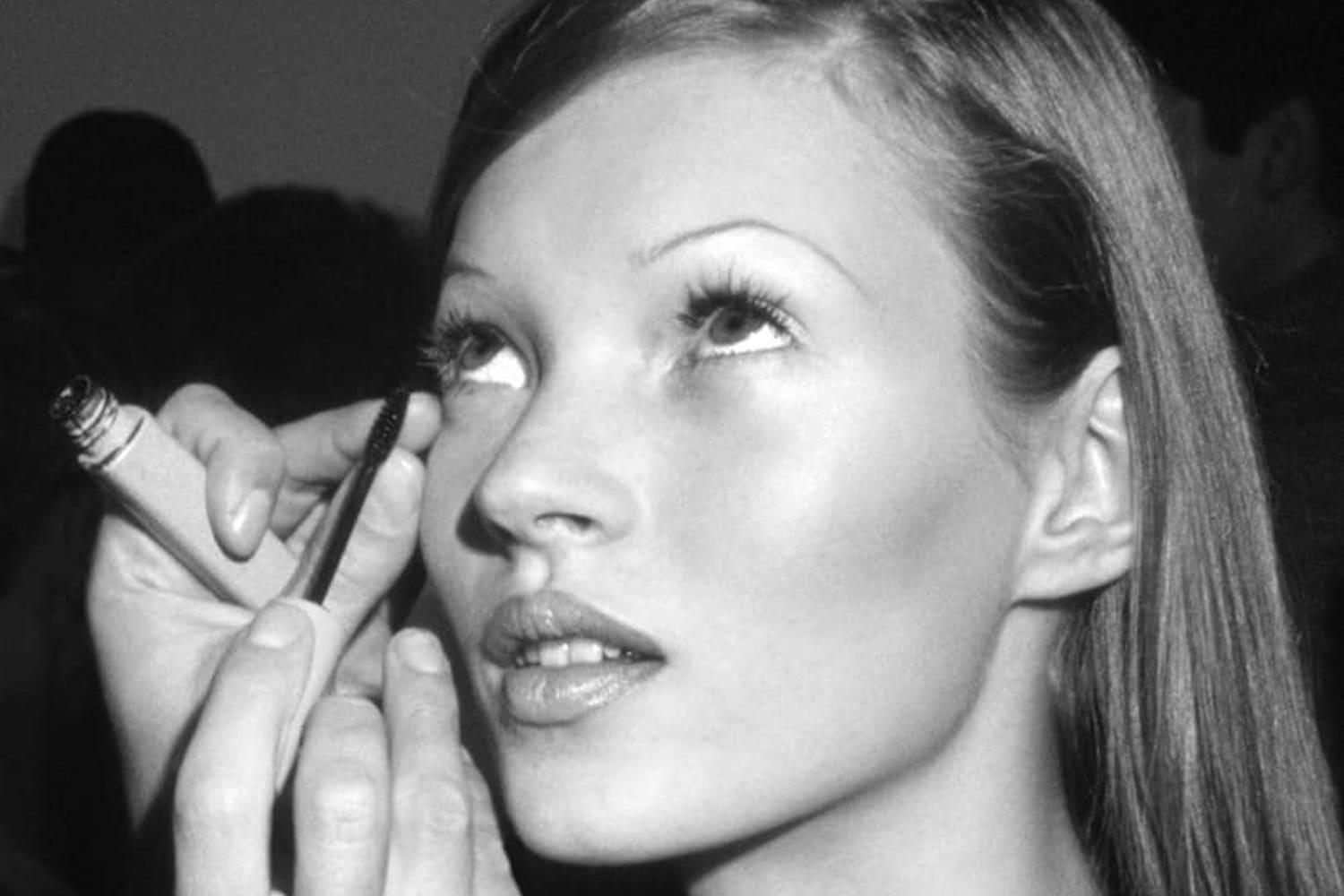 Close-up of lifted lashes with natural curl and dark tint, styled against skin