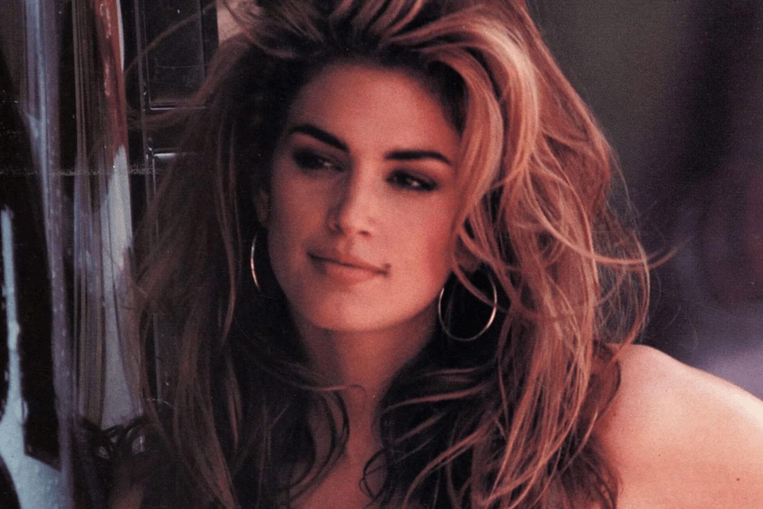 Close-up portrait of voluminous, tousled hair with warm lighting