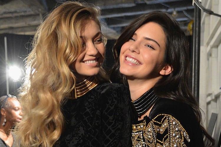 Two women with blonde and brunette hair colour melts backstage at fashion show