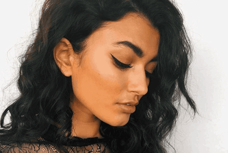 Professional hairstylist Robert Maiolo styling hair in salon setting