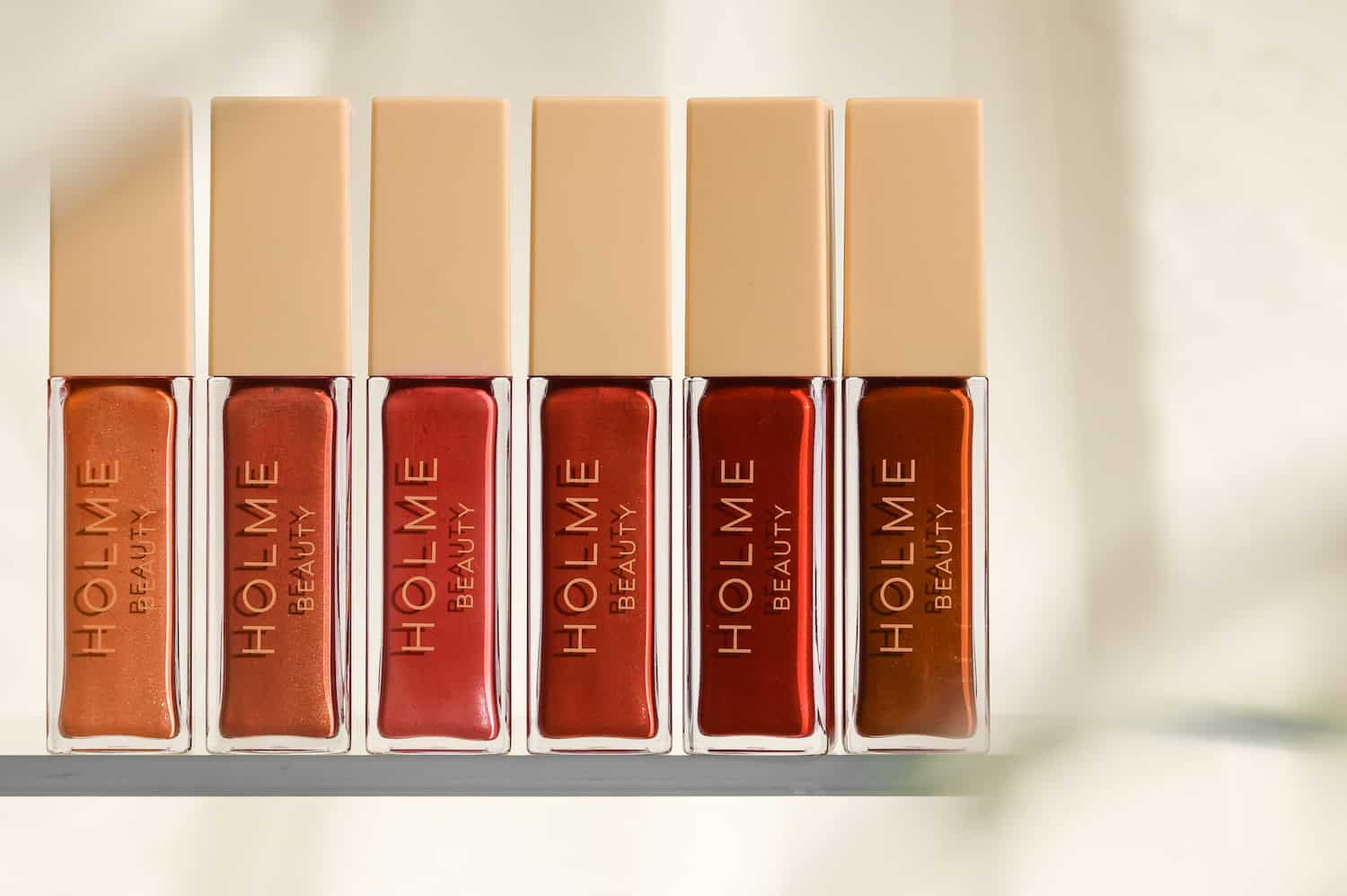 Holme Beauty Embodiment liquid blush shades displayed on a neutral surface