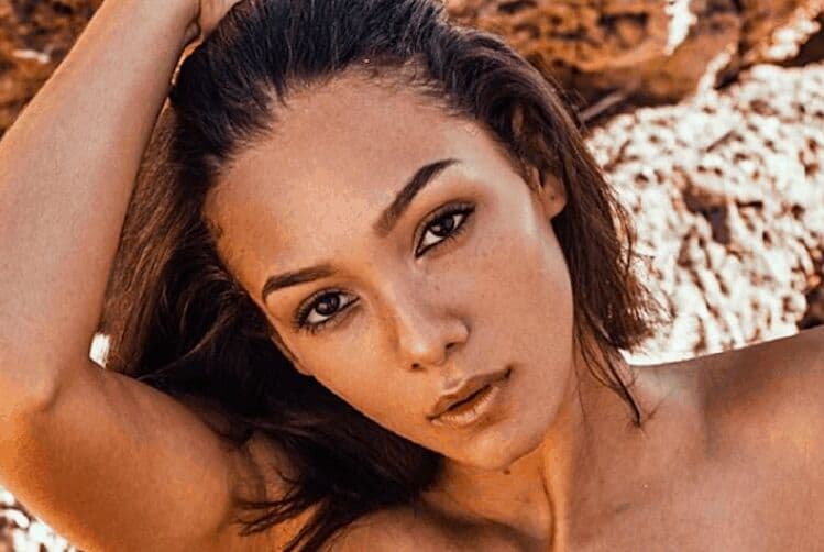 Woman with clear, even-toned skin displaying results from pigmentation treatment products