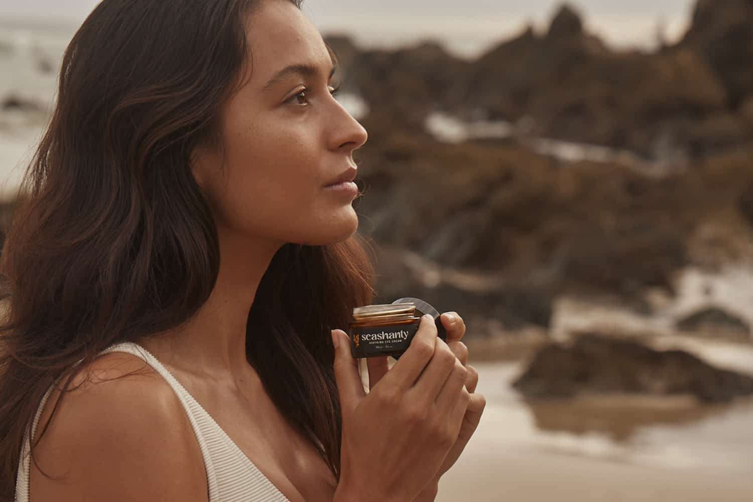 Wild-harvested seaweed and coastal ingredients arranged with green skincare serums and bottles