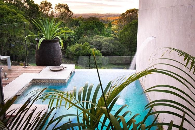 Luxurious villa balcony overlooking tropical gardens and private plunge pool at Gaia Retreat in Byron Bay