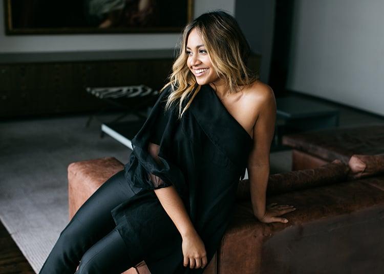 Jessica Mauboy applying makeup, showcasing her everyday beauty routine with minimal foundation and natural lip colour