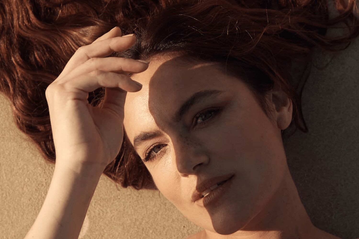 Julia Stone in contemplative portrait, natural lighting