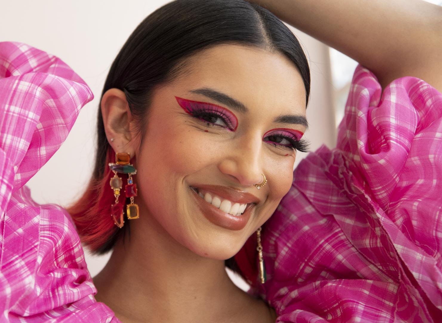 Rowi Singh wearing bold, artistic makeup with Indian-inspired jewellery and creative eye design