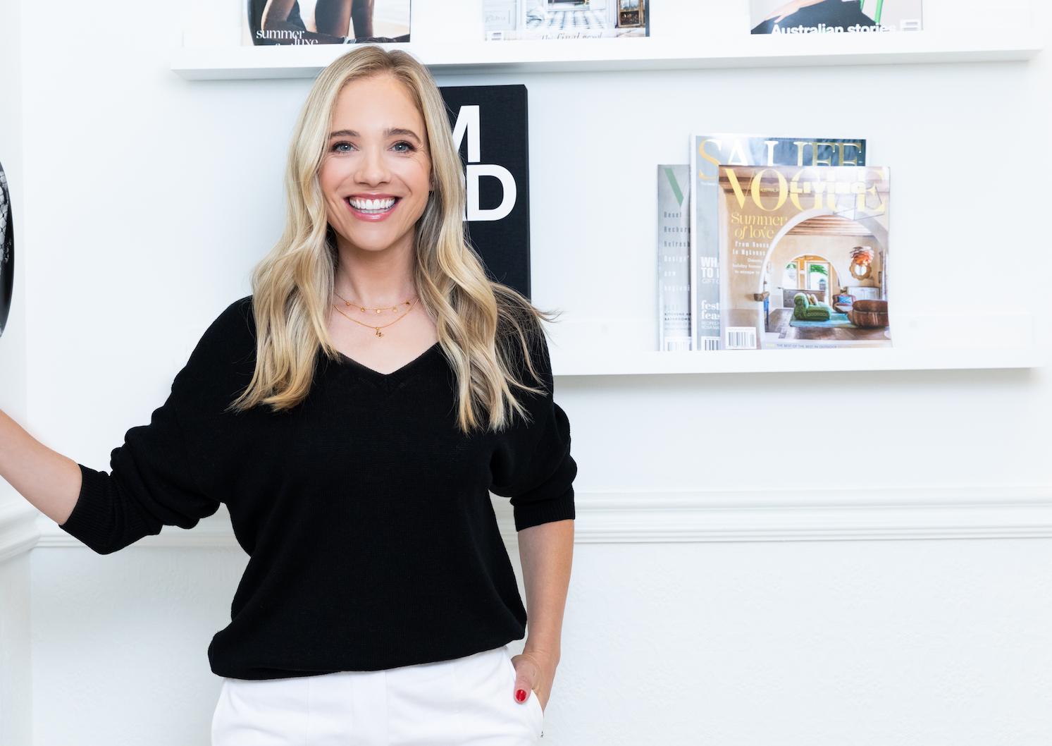Erin Fraser in her minimalist beauty workspace at Blancspace Maison, surrounded by luxury beauty products including Tom Ford and Laura Mercier