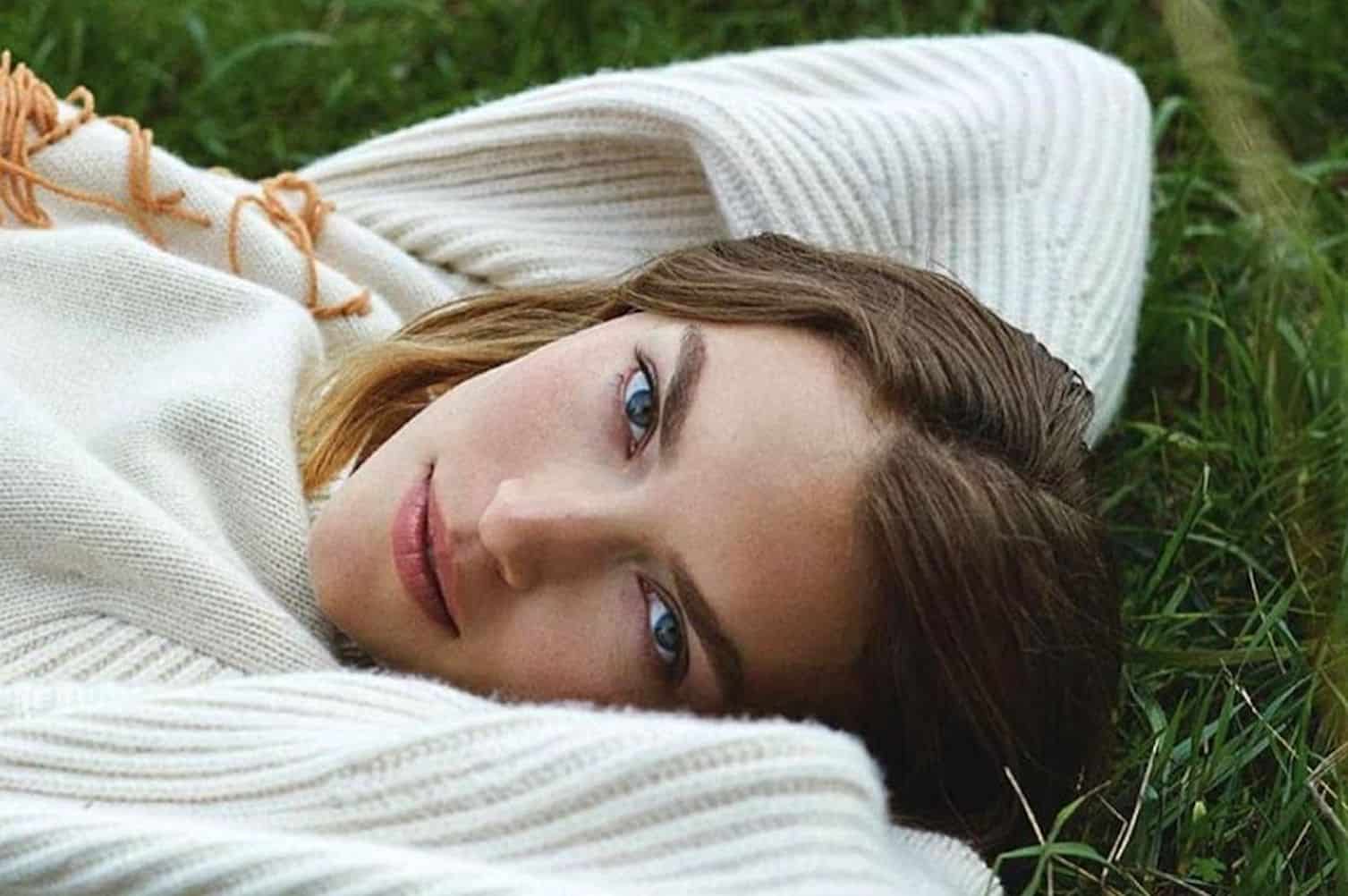 Arizona Muse, blonde supermodel in natural light wearing minimal makeup and organic skincare products
