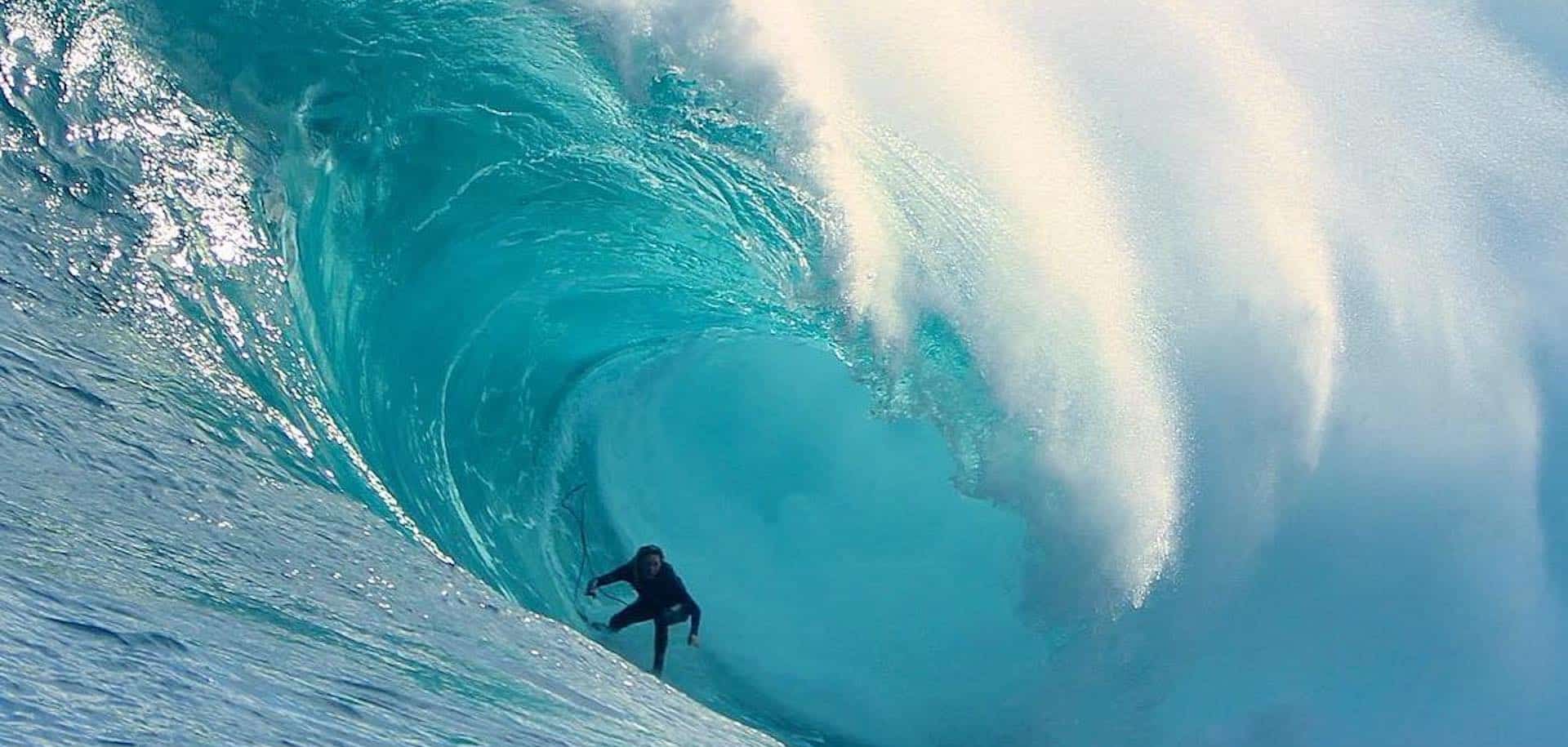 Pro surfer Laura Enever in action during big wave surfing, demonstrating fearless technique in powerful ocean conditions