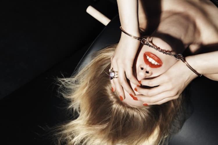 Woman's face with bold, artistic makeup application showcasing confidence and self-expression