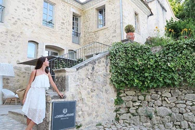 Spa relaxation room with grey marle beds overlooking rolling Provençal hills and swimming pool