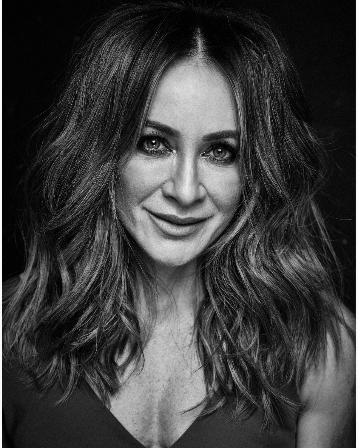 Michelle Bridges, the Beauticate Collective fitness editor, in a black and white portrait