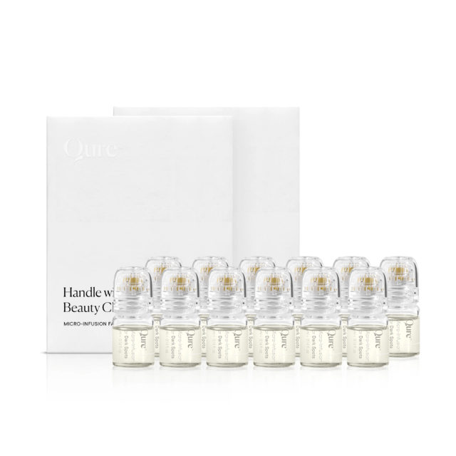 Qure Micro-Infusion Facial kit with white box and row of pale gold serum vials with applicator caps