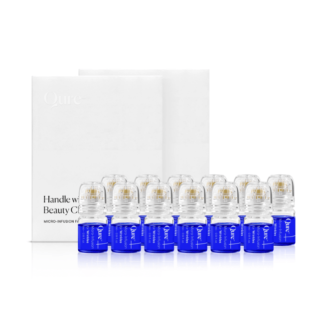 Qure Micro-Infusion Facial kit with white box and row of blue serum vials with micro-infusion applicator caps