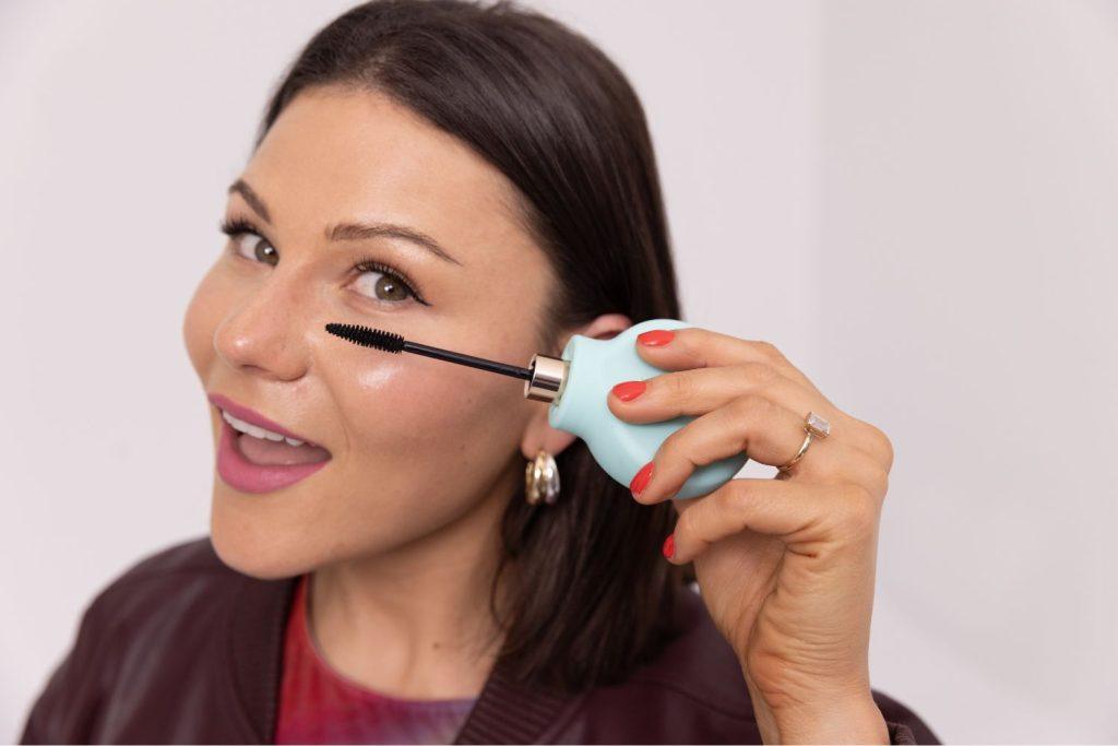 Storm Menzies, disability advocate and founder of ByStorm, demonstrating her accessible beauty tool with Celeste Barber