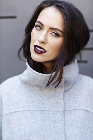 Sigourney Wears MAC Lip Liner in Vino and MAC Lipstick in Media. Coat by Max Mara