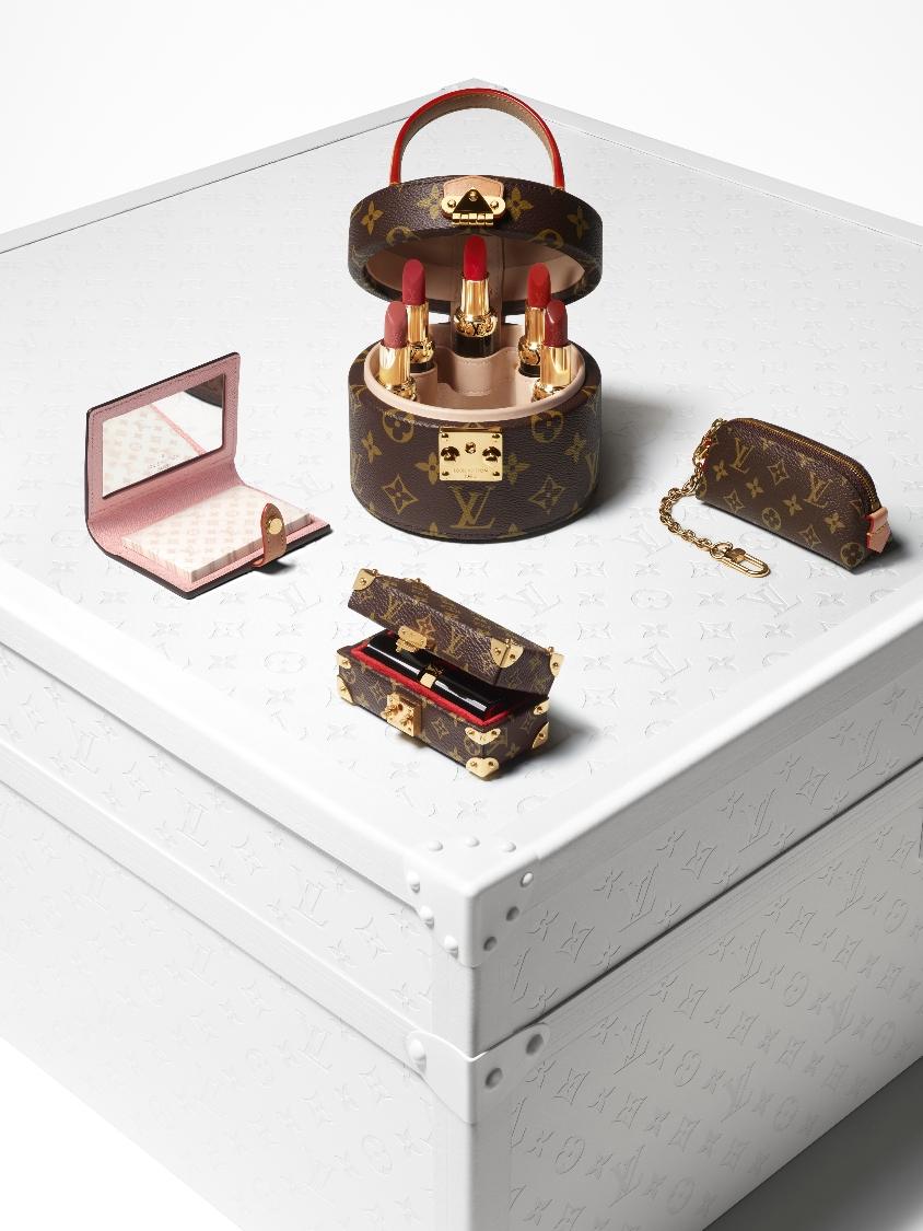 Louis Vuitton lipstick displayed in a Louis Vuitton makeup case - surrounded by Louis Vuitton products