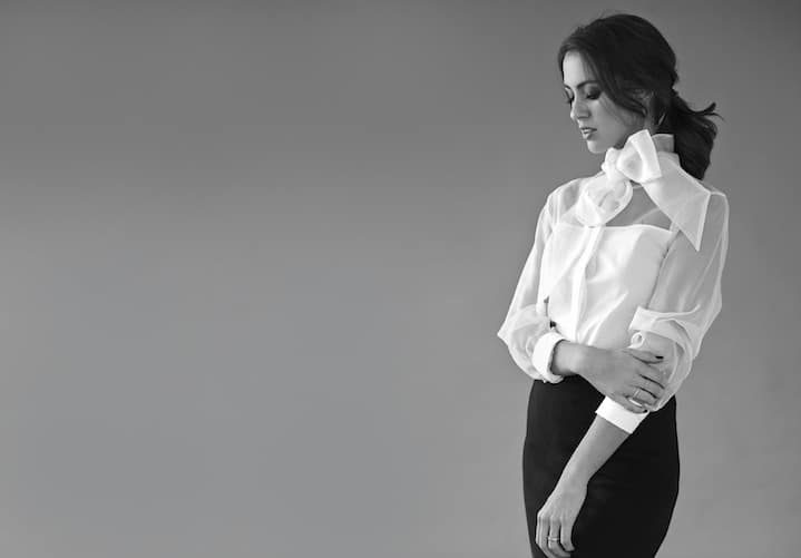 Sigourney Cantelo in a Witchery white organza pussy bow shirt with smoky eye and tousled ponytail
