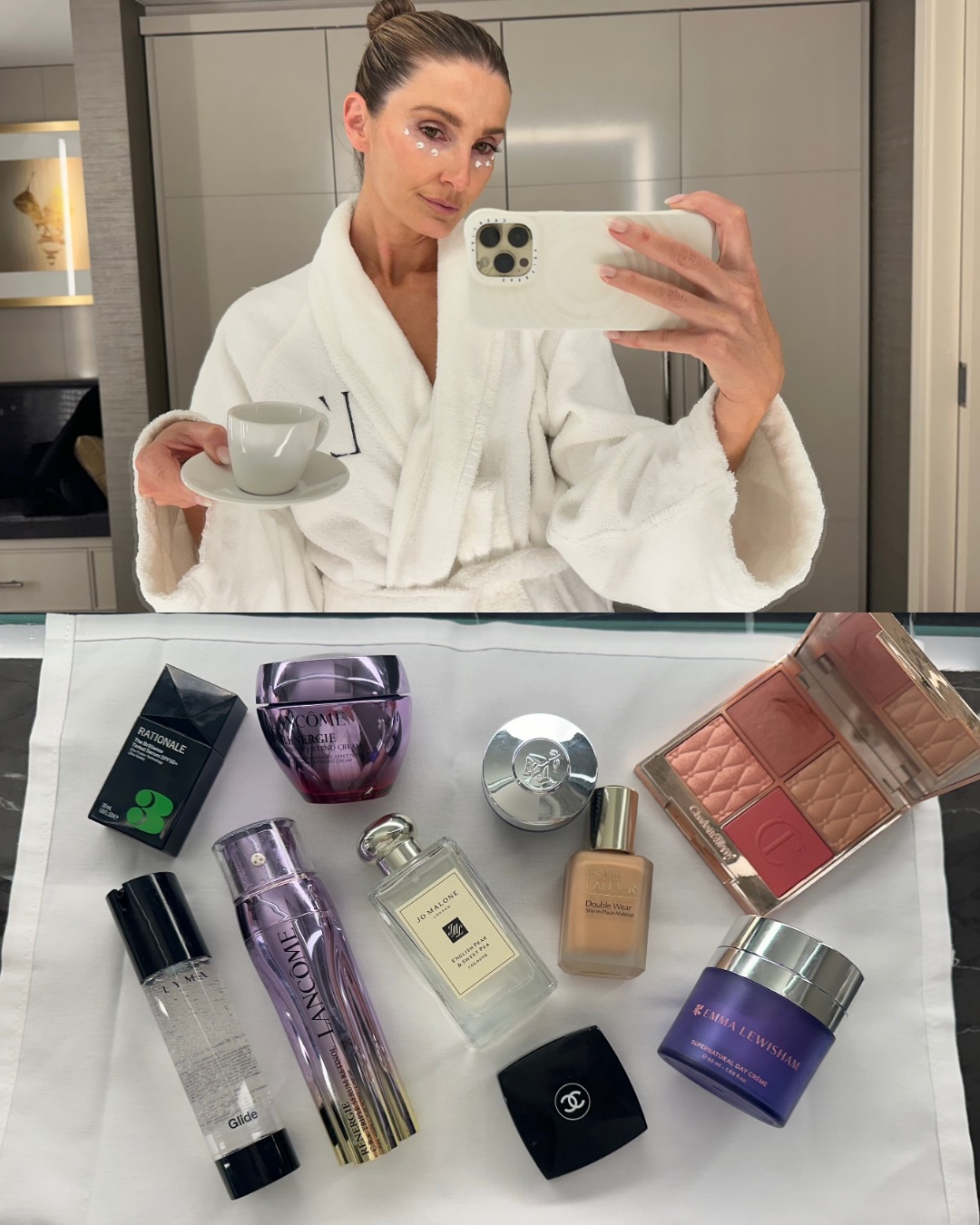 Kate Waterhouse taking a mirror selfie in a white hotel robe with hair swept up in a bun, glowing skin and a smoky eye - via @katewaterhouse7 on Instagram
