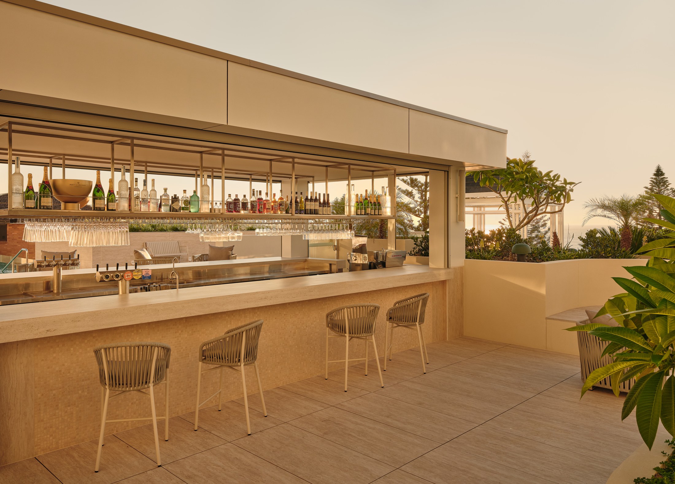 The poolside bar on the leisure deck at InterContinental Sydney Coogee Beach in late afternoon light