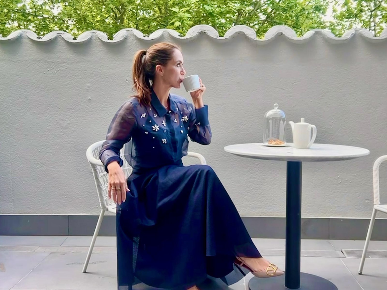 Old Hollywood style on the terrace at The Royce Hotel Melbourne, tea service and a tulle skirt against art deco surrounds