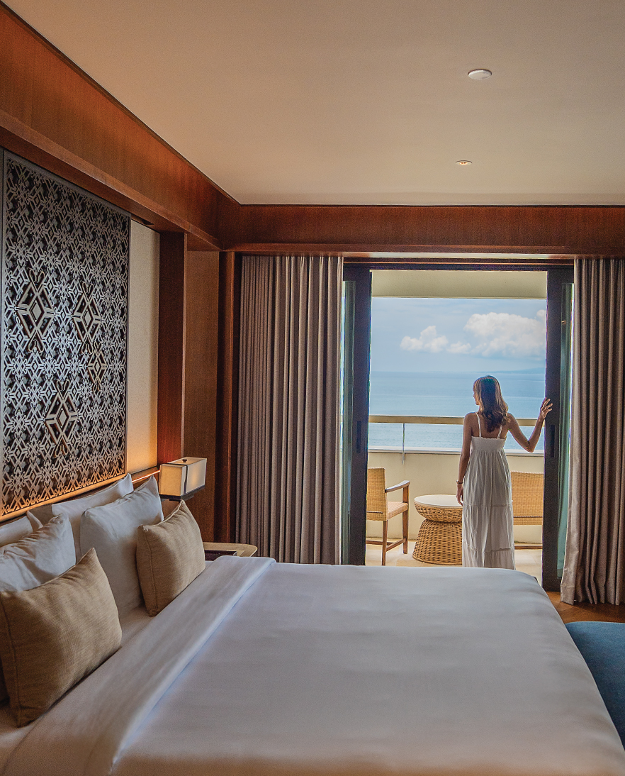 An Executive Suite at Bali Beach Hotel with a spacious study area, walk-in wardrobe and ocean-view bathroom
