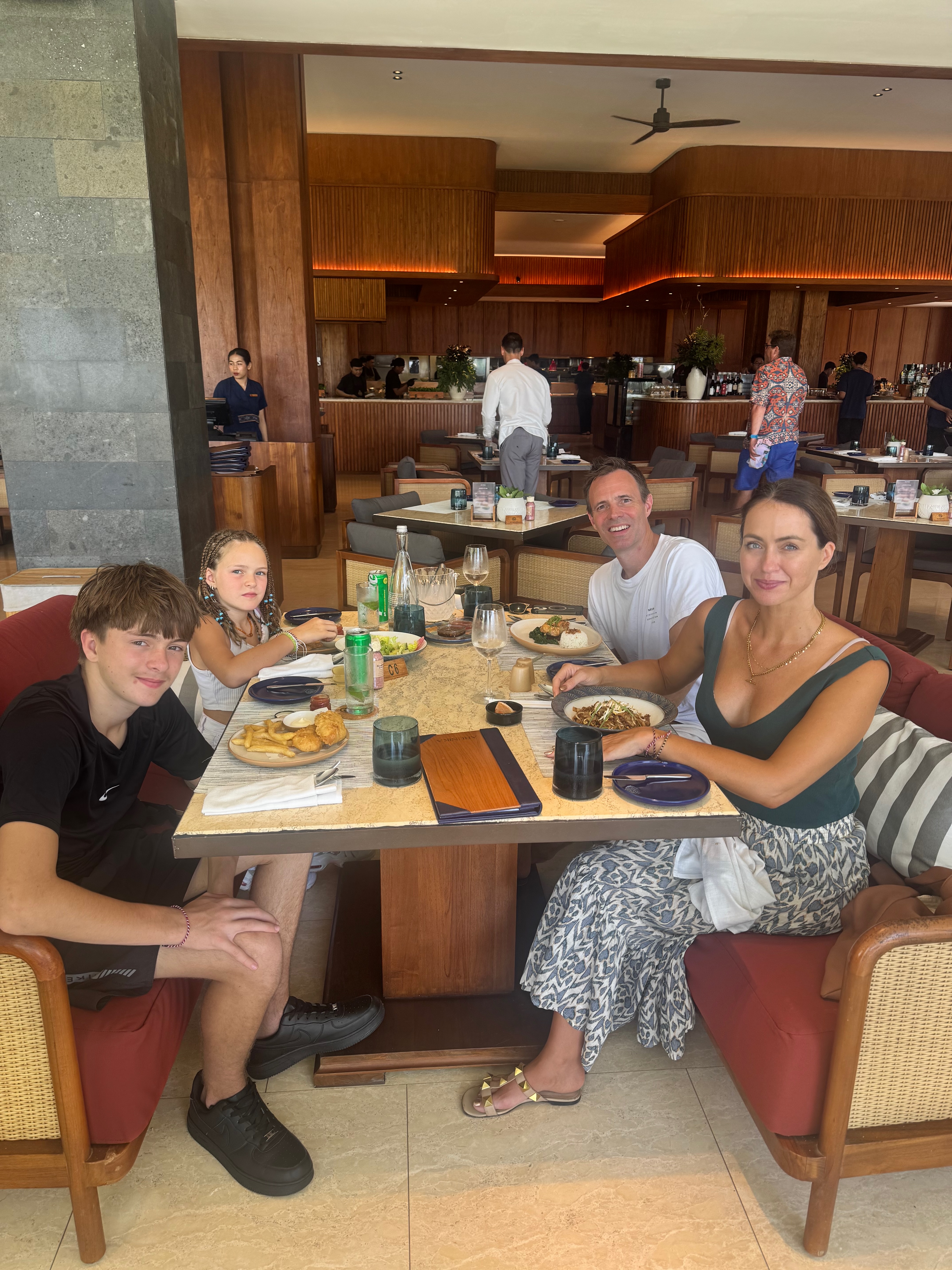 A family lunch at Arunika restaurant, an open-air pavilion beside the pool at Bali Beach Hotel