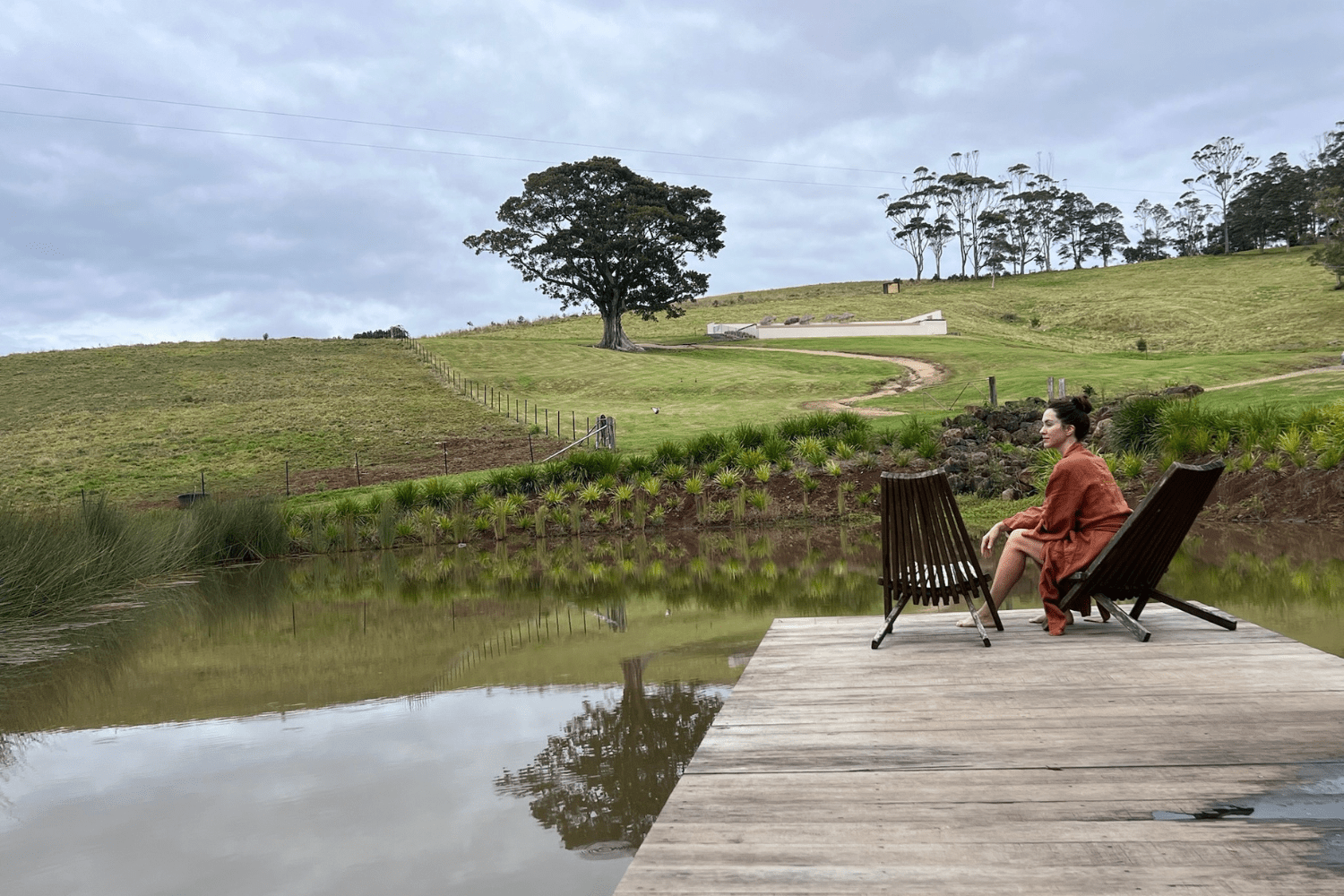 woman at a dam looking out at the scenery