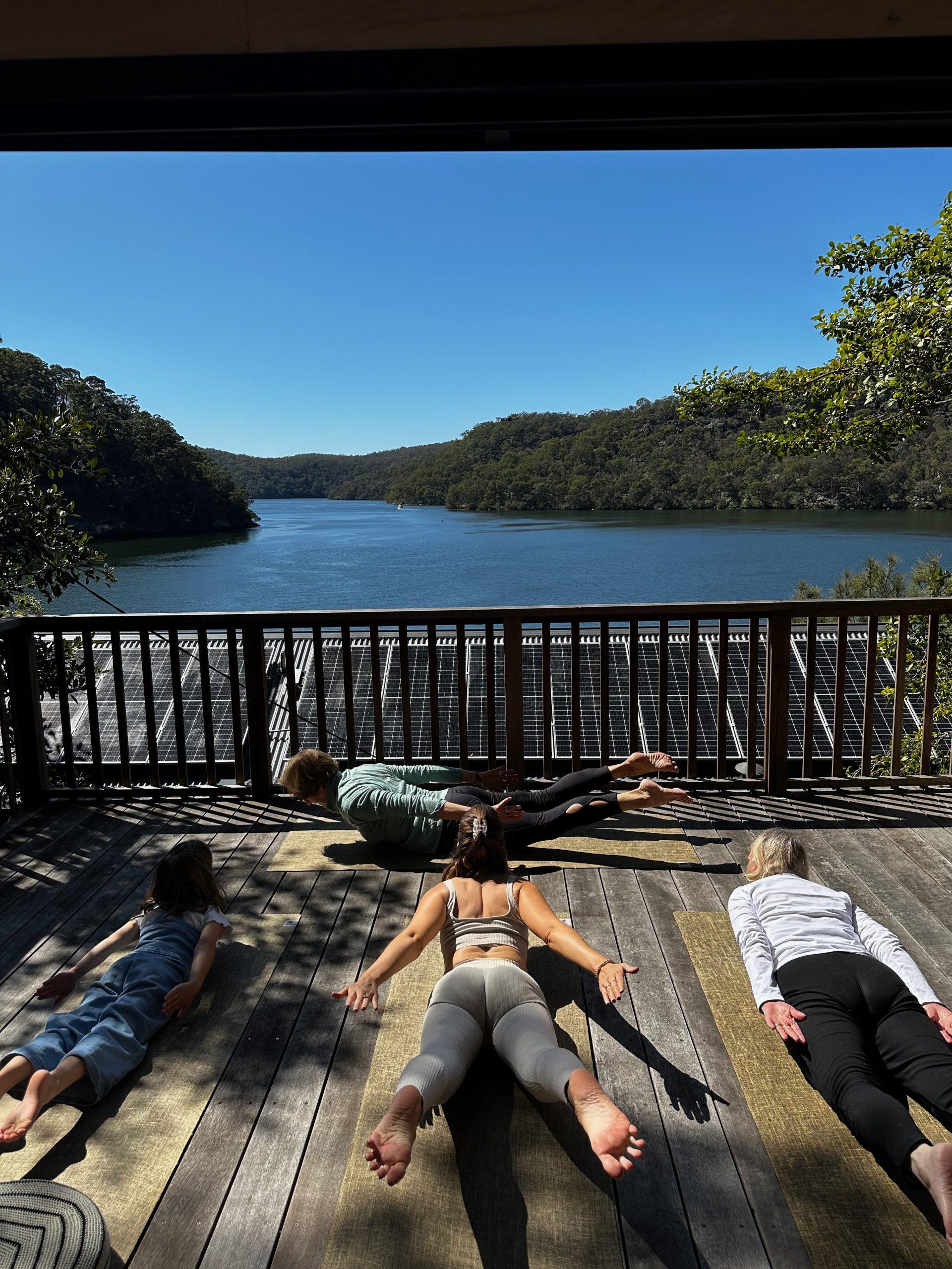 Family gathered around the fire at Calabash Bay Lodge, Hawkesbury River, NSW