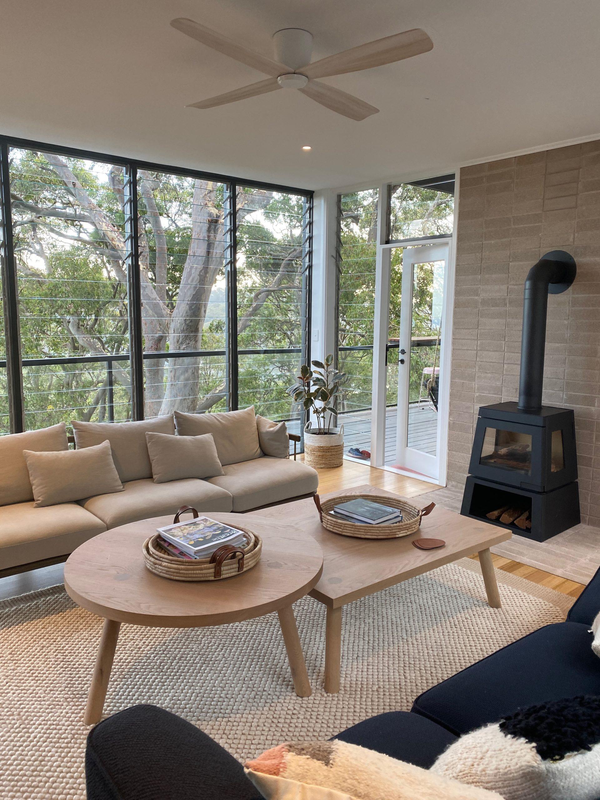 Curved pool and cedar hot tub surrounded by native greenery at Crane Lodge, Pittwater