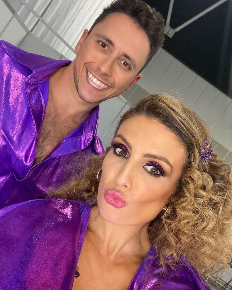 Rocking a subtle, low key disco look with DWTS dance partner Aric Yegudkin