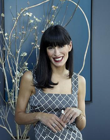 Athena Calderone at home with views of Manhattan
